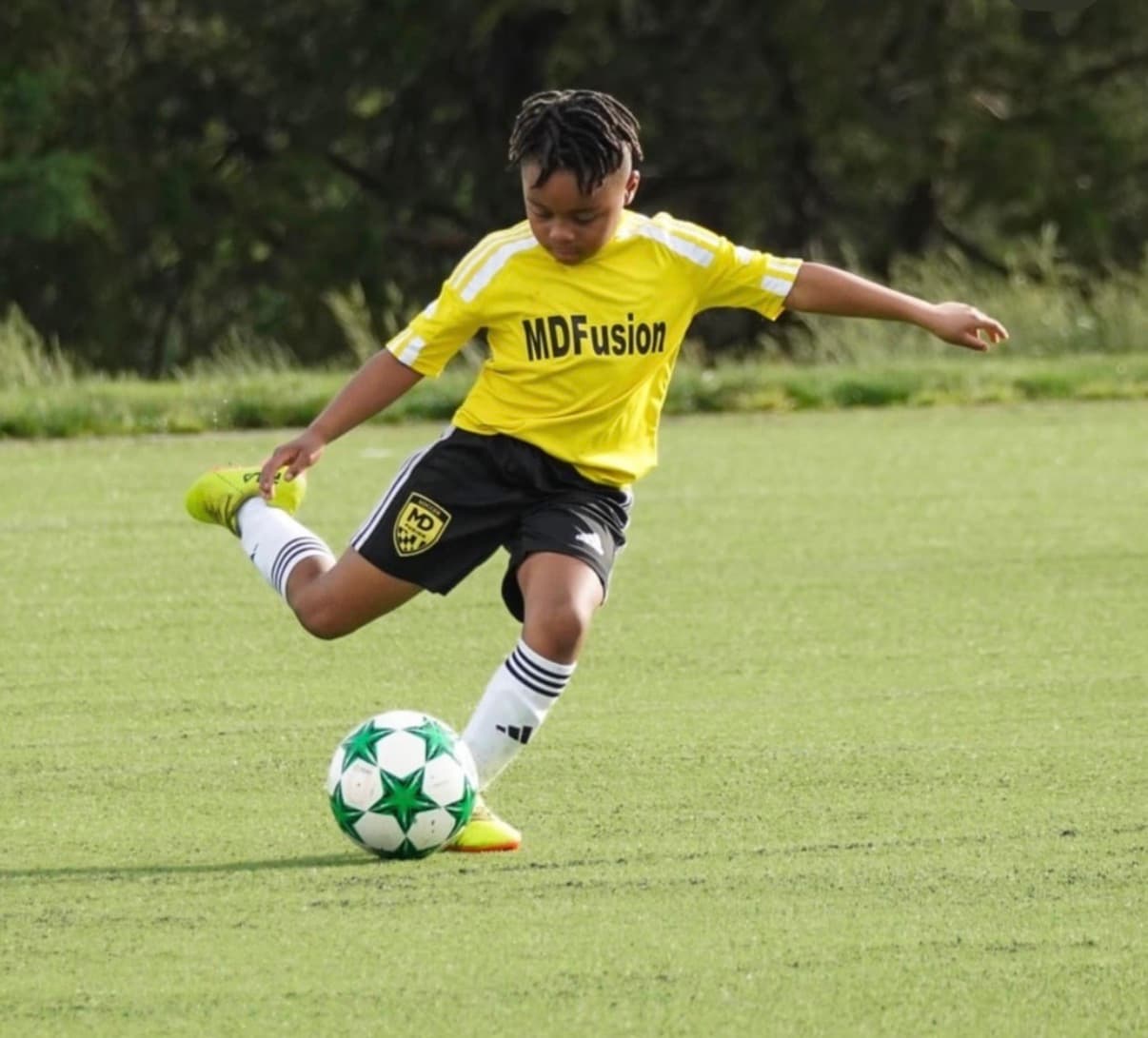A coach working one-on-one with a player on technical training