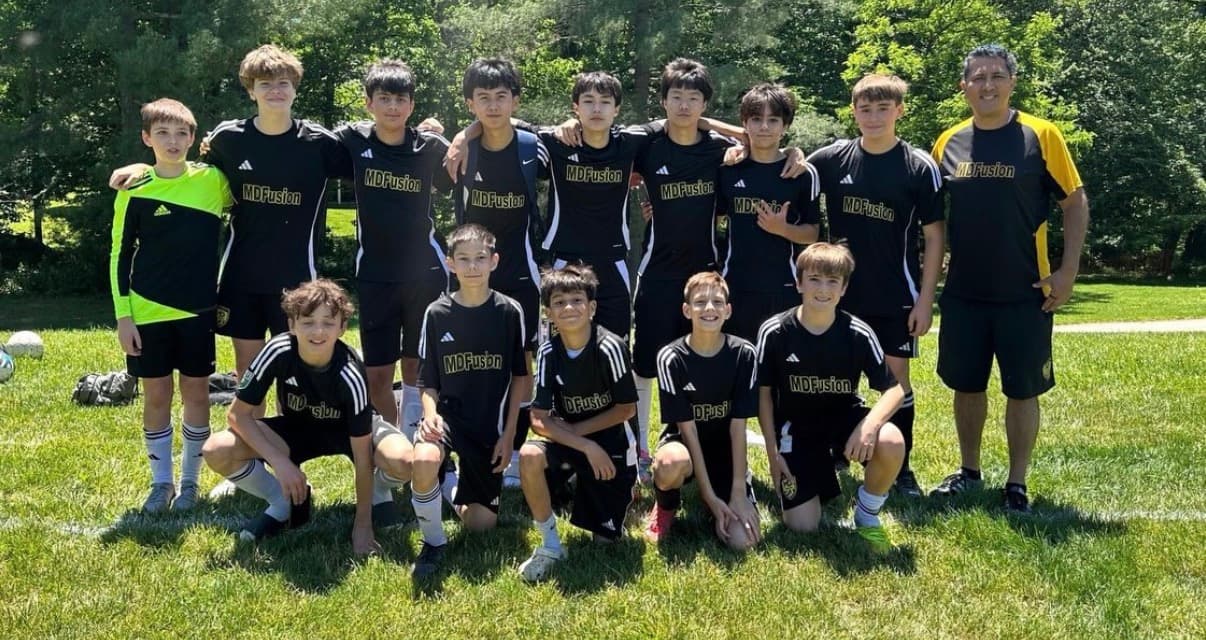 MD Fusion Academy (Travel) players sitting together during a training break